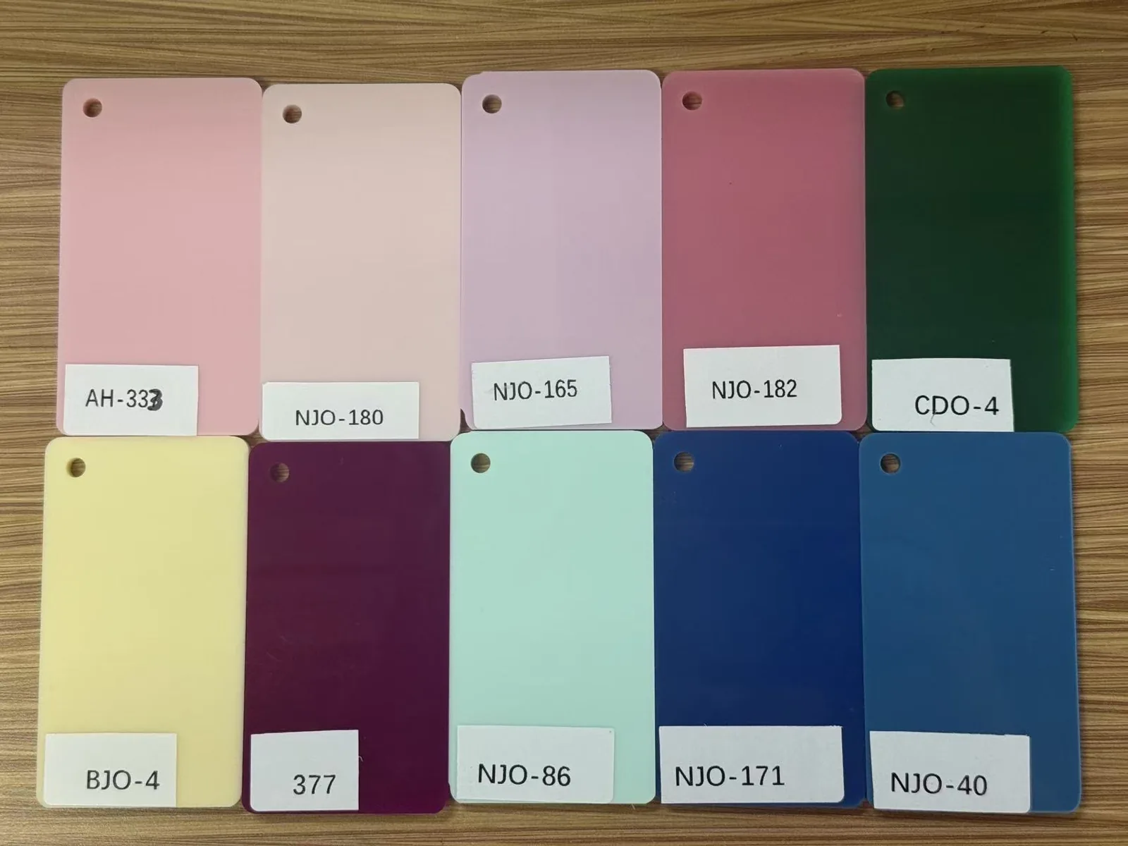 Ten solid acrylic color swatches