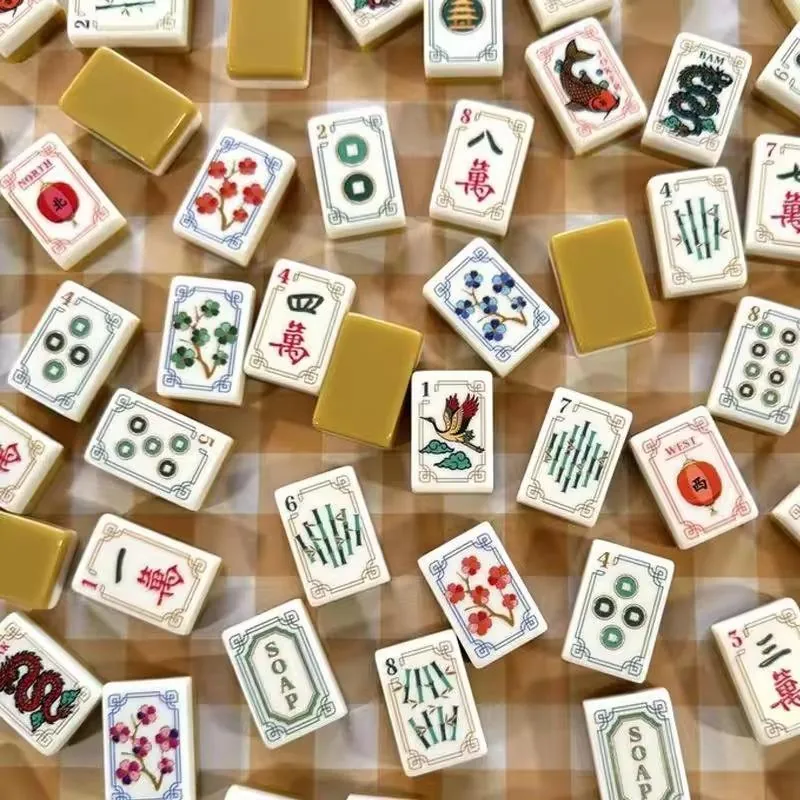 Mahjong tiles on a gingham cloth