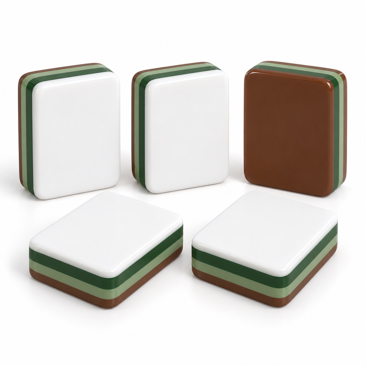 Brown and green layered acrylic Mahjong tiles photographed on a plain background