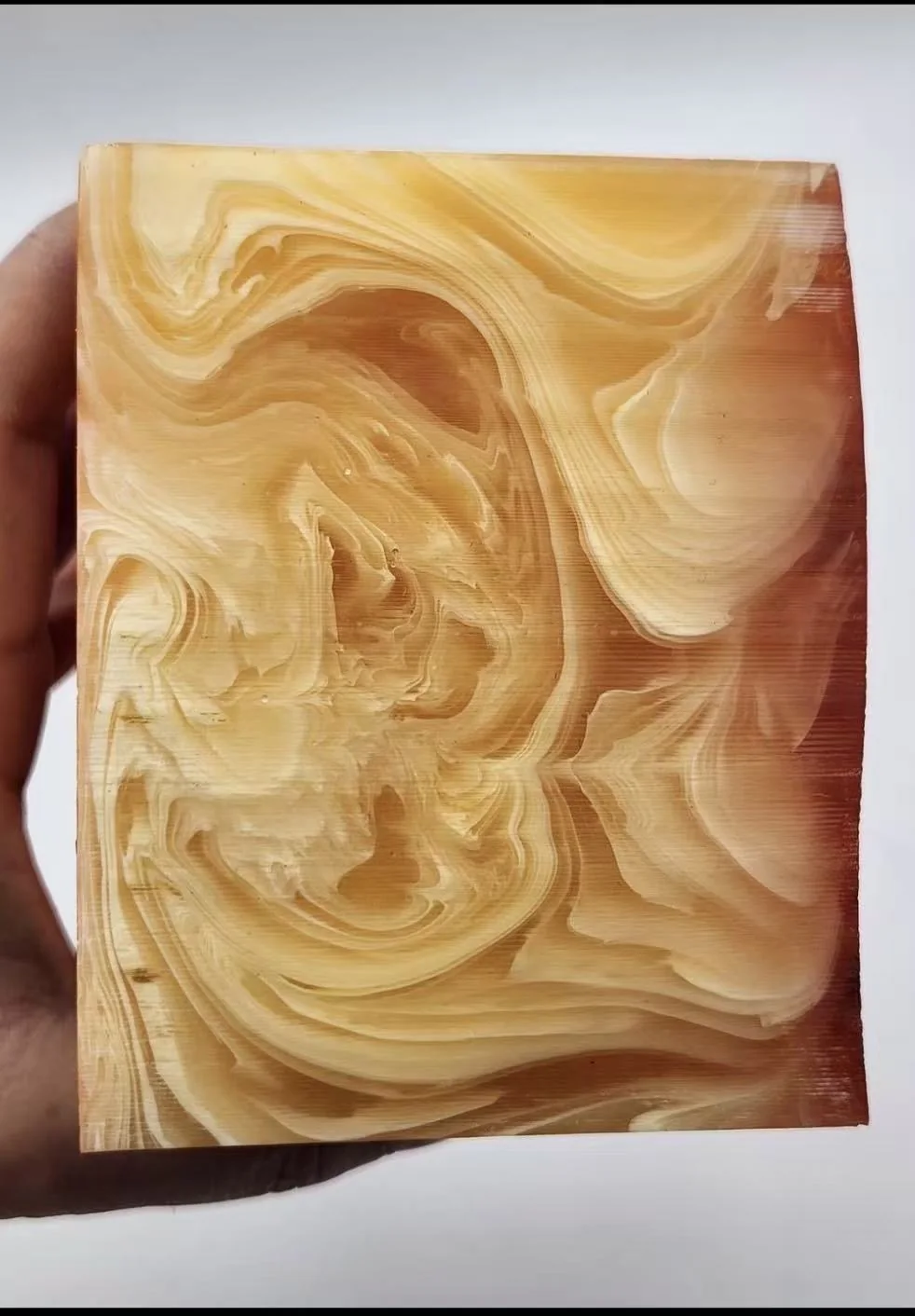 Amber marble swirl acrylic material sample
