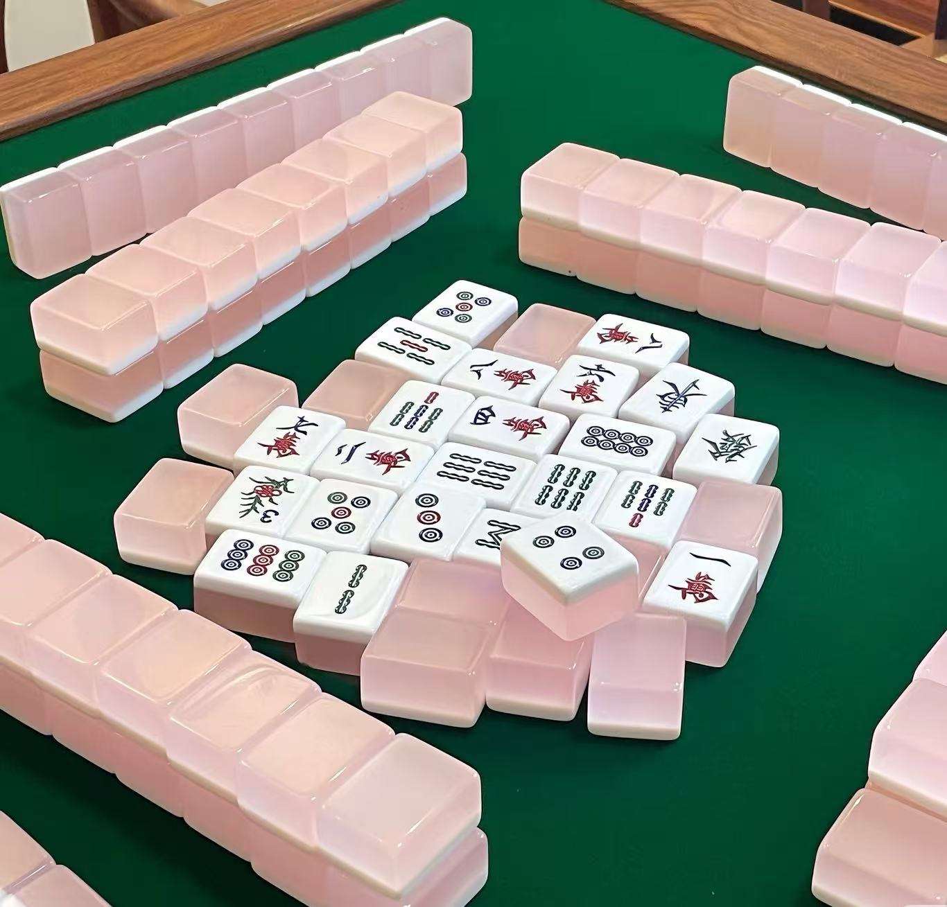 Stacked pink lucite Mahjong tiles for travel set